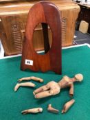 A ANTIQUE HAND CARVED WOODEN DOLL AND A PROPELLER TIP PHOTO FRAME.