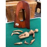 A ANTIQUE HAND CARVED WOODEN DOLL AND A PROPELLER TIP PHOTO FRAME.