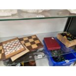 A STAUNTON STYLE WOODEN CHESS SET AND BOARD, A TRAVELLING CHESS SET AND A BEZIQUE SET