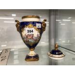 A COALPORT TWO HANDLED VASE AND COVER PAINTED BY RICHARD BUDD COMMEMORATING THE SAILING OF THE