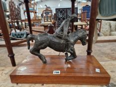 A BRONZE MODEL OF A POLO PLAYER ON WOOD PLINTH