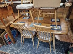 AN ERCOL ELM DINING TABLE. 72 X 152 X 76CMS, TOGETHER WITH SIX ERCOL CHAIRS.
