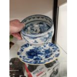 AN 18th C. DELFT BLUE AND WHITE PLATE TOGETHER WITH A FAENZA BLUE AND WHITE BOWL INSCRIBED P