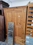 A LARGE PINE TWO DOOR WARDROBE. 191 X 124 X 59CMS.