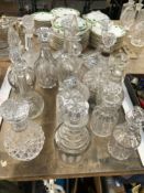 FIFTEEN DECANTERS AND STOPPERS, TO INCLUDE ONE WITH A SILVER MOUNTED NECK