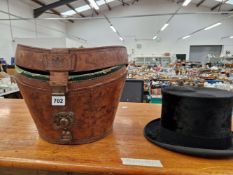 A LEATHER CASED LINCOLN BENNETT BLACK SILK PILE TOP HAT