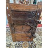 A CARVED HARD WOOD CABINET FRONT WITH DOORS.
