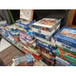 A LARGE QUANTITY OF BOXED JIGSAW PUZZLES