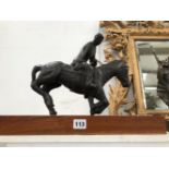 A BRONZE FIGURE OF A POLO PLAYER