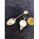 A SCHWABE & CO, RHODES WORKS BRONZE TOKEN, STAMPED 446, TOGETHER WITH A MAP MEASURE, AND A