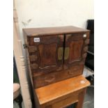 A ORIENTAL TABLE CABINET WITH FITTED INTERIOR