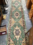 A VINTAGE GREEN GROUND EASTERN RUNNER, A FLAT WEAVE BAG, AND A SMALL RED GROUND MAT. LARGEST 322 X