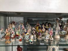 A LARGE COLLECTION OF GERMAN PORCELAIN FIGURES TO INCLUDE FIVE OF A MONKEY BAND