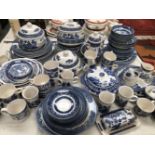 A QUANTITY OF BLUE AND WHITE DINNER WARES.