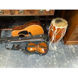 A SMALL MODERN VIOLIN A DRUM AND A HOHNER GUITAR