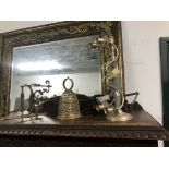 A BELL PULL WITH A BRASS BELL TOGETHER WITH A THREE LIGHT METAL CANDELABRUM