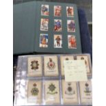 TWO ALBUMS OF VARIOUS CIGARETTE CARDS AND SILKS.