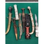 A VINTAGE EASTERN TANTO KNIFE, FIVE FURTHER EASTERN KNIVES AND A HUNTING KNIFE.