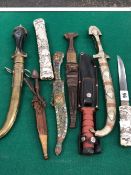 A VINTAGE EASTERN TANTO KNIFE, FIVE FURTHER EASTERN KNIVES AND A HUNTING KNIFE.