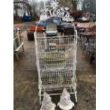 A METAL BOOT RACK-WELCOME, AND TWO STONE WARE GARDEN WALL ORNAMENTS.