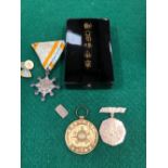 AN ANTIQUE JAPANESE SILVER TOKEN, TOGETHER WITH AN ORDER OF THE SACRED TREASURE 8th CLASS,