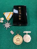 AN ANTIQUE JAPANESE SILVER TOKEN, TOGETHER WITH AN ORDER OF THE SACRED TREASURE 8th CLASS,
