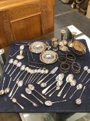 A QUANTITY OF HALLMARKED SILVER TO INCLUDE VARIOUS SPOONS, CANDLESTICKS, CRUETS, CONDIMENT DISHES,