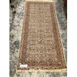 TWO EASTERN PATTERNED SMALL RUGS. 200 X 123CMS AND 315 X 97CMS.