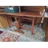 A OAK AND MAHOGANY GATE LEG TABLE