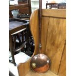 A VICTORIAN COPPER WARMING PAN OF UNUSUAL DESIGN.