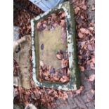 AN ANTIQUE STONE SHALLOW SINK.