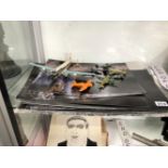 A COLLECTION OF DAN MAC CASSILL PHOTOGRAPHS TOGETHER WITH EIGHT DIE CAST AIRCRAFT