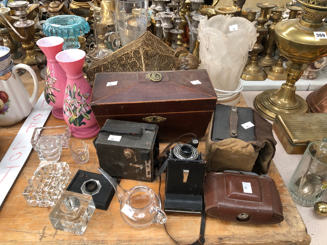 A COPPER GRADED SET OF MEASURES, BRASS FIRE IRONS, ELECTROPLATE CUTLERY, CAMERAS, A TEA CADDY AND