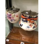 TWO POTTERY BISCUIT BARRELS WITH ELECTROPLATE LIDS