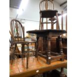 A PAIR OF WHEEL BACK CHILDS CHAIRS TOGETHER WITH A CARVED OAK COFFEE TABLE AND A TILED TOP TABLE (