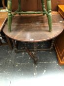 AN ANTIQUE OAK SMALL COTTAGE GATE LEGGED TABLE