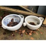 TWO ANTIQUE TOILET BOWLS INCLUDING A BLUE AND WHITE EXAMPLE.