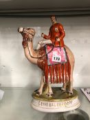 A STAFFORDSHIRE POTTERY FIGURE OF GENERAL GORDON RIDING A CAMEL