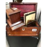 A MAHOGANY MATCH DISPENSER, A ROSEWOOD TEA CADDY, FOUR SMALL PAINTED GLASS PANELS TOGETHER WITH