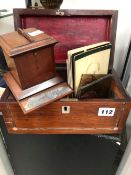 A MAHOGANY MATCH DISPENSER, A ROSEWOOD TEA CADDY, FOUR SMALL PAINTED GLASS PANELS TOGETHER WITH