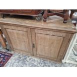 AN ANTIQUE OAK SIDE CABINET