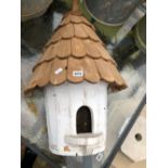 A WELL MADE WALL MOUNTING BIRD HOUSE.