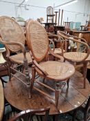 A PAIR OF ANTIQUE BENTWOOD ARMCHAIRS AND TWO SIMILAR CANE SEAT AND BACK CHAIRS.