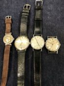 FOUR WRISTWATCHES TO INCLUDE BULOVA, ORIS, AND MOVADO.