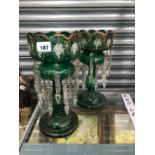 A PAIR OF VICTORIAN FLORAL ENAMELLED GREEN GLASS LUSTRES