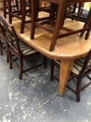 A ANTIQUE OAK WIND OUT EXTENDING DINING TABLE