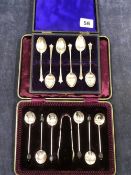 TWO SETS OF HALLMARKED SILVER COFFEE SPOONS IN FITTED CASES, ONE SET WITH SUGAR NIPS AND WITH COFFEE