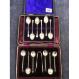 TWO SETS OF HALLMARKED SILVER COFFEE SPOONS IN FITTED CASES, ONE SET WITH SUGAR NIPS AND WITH COFFEE