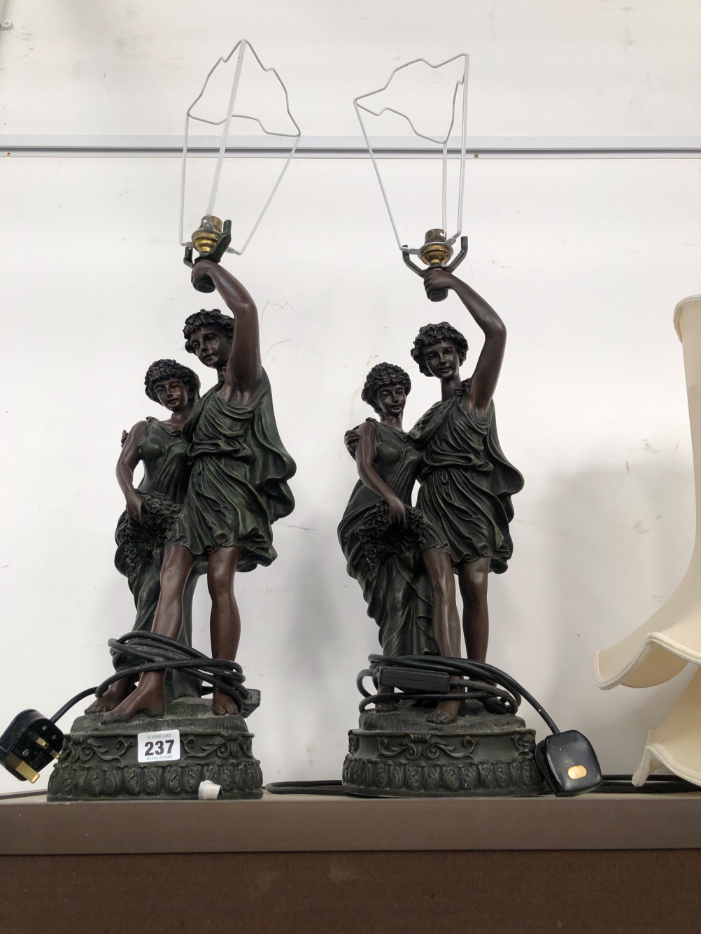 TWO SIMILAR SPELTER CLASSICAL COUPLES STANDING AS TABLE LAMPS WITH SHADES