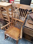AN ANTIQUE KITCHEN SPINDLE BACK ROCKING CHAIR AND A MODERN WINE RACK